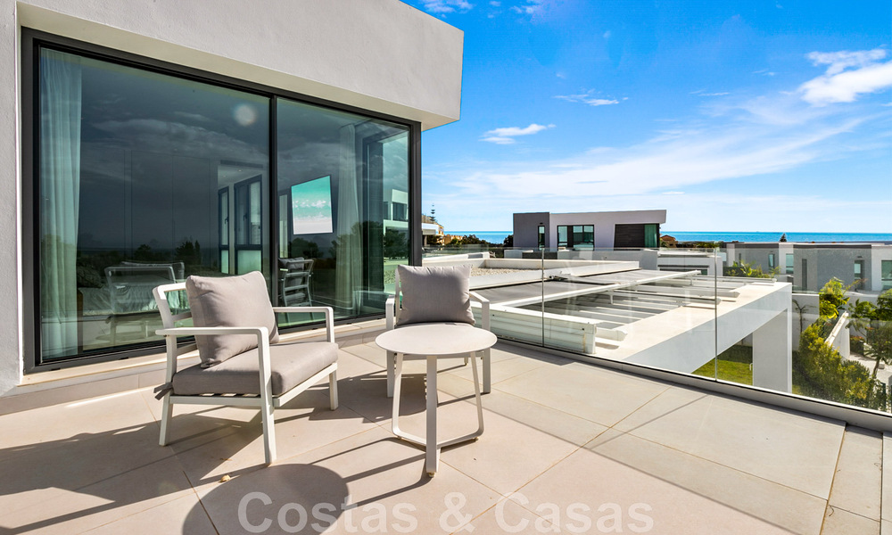 Move-in ready, contemporary villa for sale with sea views, in a gated villa development on the border of Mijas and Marbella 46108