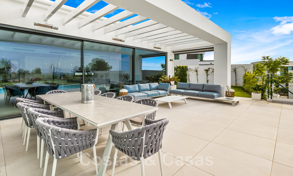 Move-in ready, contemporary villa for sale with sea views, in a gated villa development on the border of Mijas and Marbella 46116