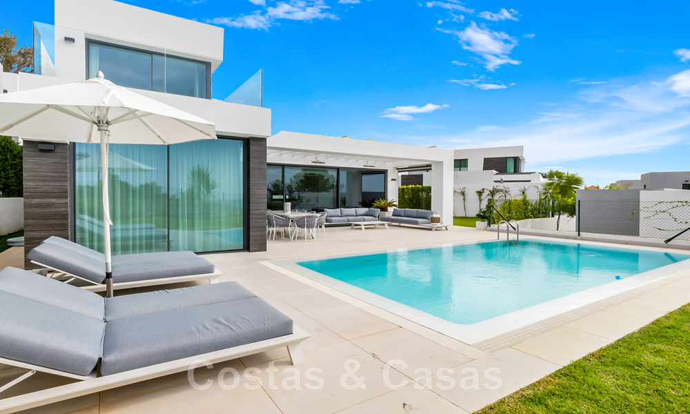 Move-in ready, contemporary villa for sale with sea views, in a gated villa development on the border of Mijas and Marbella 46118