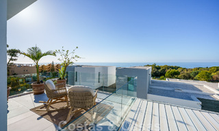 Move-in ready villa for sale with contemporary architecture in a gated villa community on the border of Mijas and Marbella 46382 