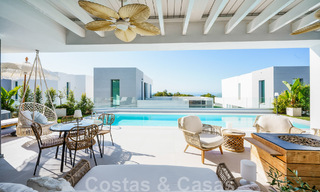 Move-in ready villa for sale with contemporary architecture in a gated villa community on the border of Mijas and Marbella 46400 
