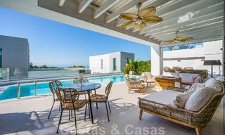 Move-in ready villa for sale with contemporary architecture in a gated villa community on the border of Mijas and Marbella 46401 