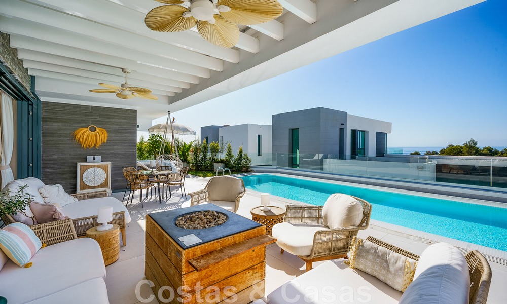 Move-in ready villa for sale with contemporary architecture in a gated villa community on the border of Mijas and Marbella 46403
