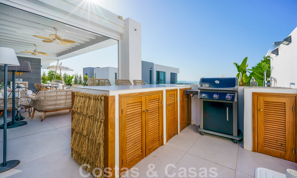 Move-in ready villa for sale with contemporary architecture in a gated villa community on the border of Mijas and Marbella 46405