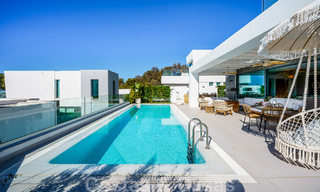 Move-in ready villa for sale with contemporary architecture in a gated villa community on the border of Mijas and Marbella 46414 