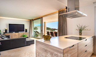 Move-in ready, elevated ground floor apartment for sale with panoramic valley and sea views in exclusive Benahavis - Marbella 47041 