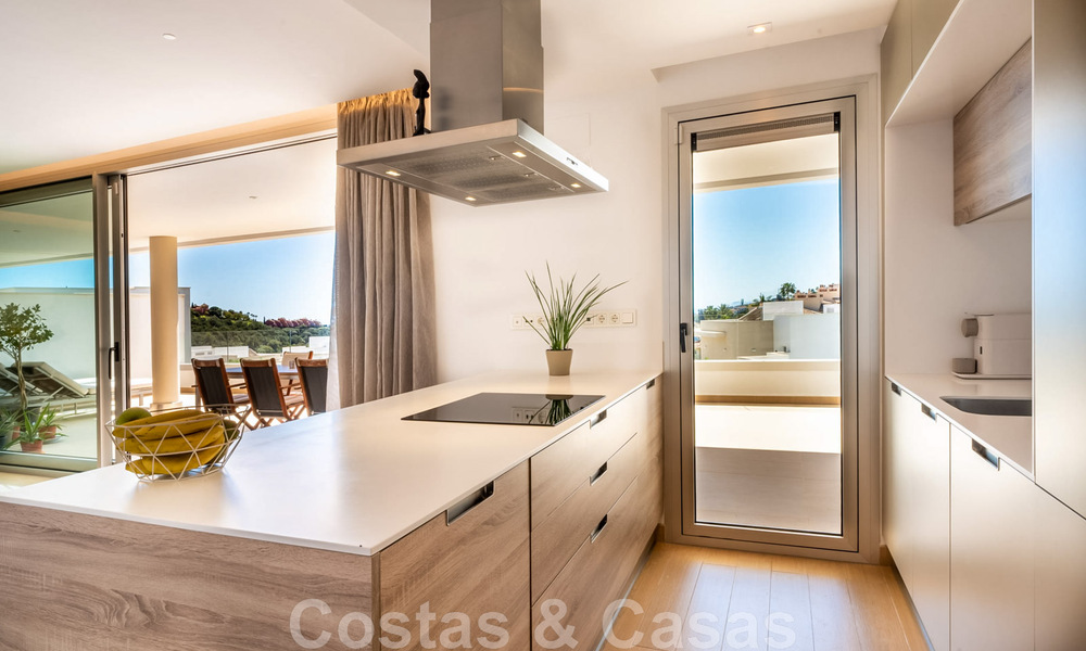 Move-in ready, elevated ground floor apartment for sale with panoramic valley and sea views in exclusive Benahavis - Marbella 47042