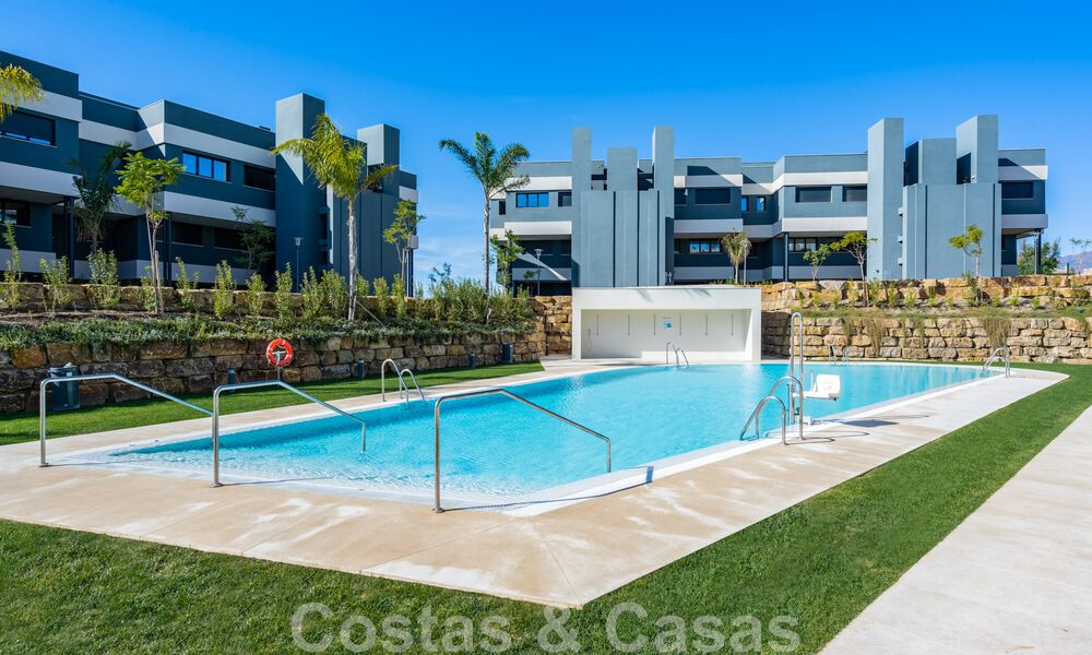 Contemporary corner apartment for sale with a large private garden on the coveted New Golden Mile between Marbella and Estepona 47155