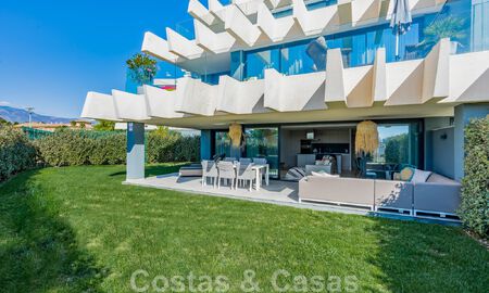 Contemporary corner apartment for sale with a large private garden on the coveted New Golden Mile between Marbella and Estepona 47166