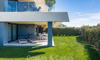 Contemporary corner apartment for sale with a large private garden on the coveted New Golden Mile between Marbella and Estepona 47168 