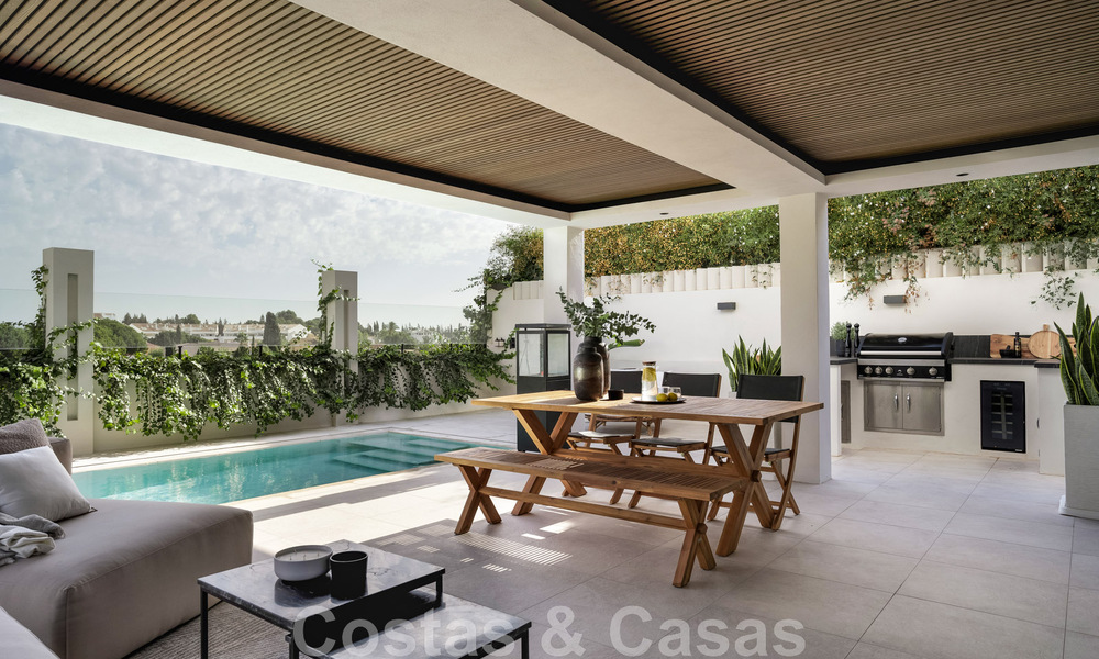New on the market! Unique villa for sale, with cosy outdoor spaces and panoramic views in Nueva Andalucia, Marbella. Walking distance to Puerto Banus. 47586