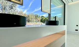 Ready to move in, exclusive high-end semi-detached villa for sale within walking distance of Puerto Banus in Nueva Andalucia, Marbella 61019 