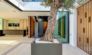 Ready to move in, exclusive high-end semi-detached villa for sale within walking distance of Puerto Banus in Nueva Andalucia, Marbella 61021 