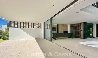 Ready to move in, exclusive high-end semi-detached villa for sale within walking distance of Puerto Banus in Nueva Andalucia, Marbella 61026 