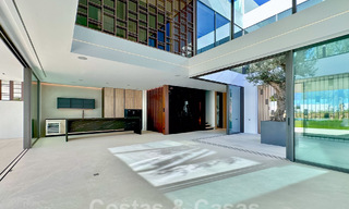 Ready to move in, exclusive high-end semi-detached villa for sale within walking distance of Puerto Banus in Nueva Andalucia, Marbella 61027 