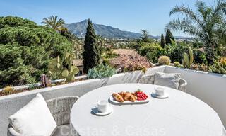 Detached Mediterranean villa for sale within walking distance of amenities overlooking the golf valley and mountain scenery in Nueva Andalucia, Marbella 47544 