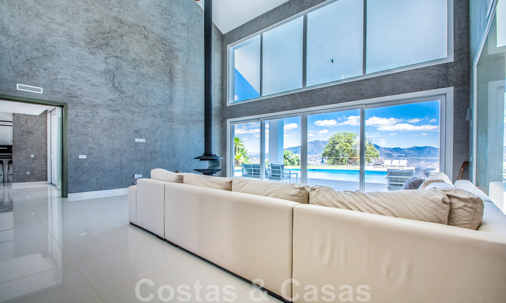 Detached villa for sale designed with modern architecture on a high position with panoramic mountain and sea views, in an exclusive urbanisation in East Marbella 47989