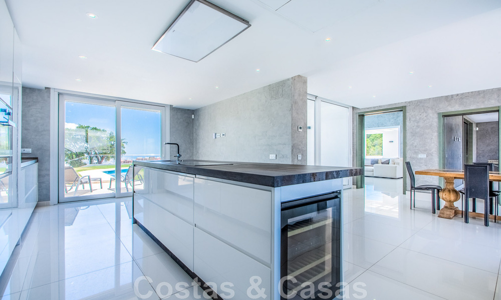 Detached villa for sale designed with modern architecture on a high position with panoramic mountain and sea views, in an exclusive urbanisation in East Marbella 47994