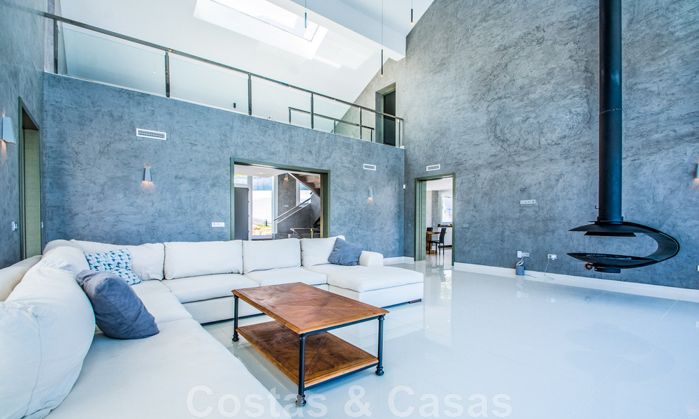 Detached villa for sale designed with modern architecture on a high position with panoramic mountain and sea views, in an exclusive urbanisation in East Marbella 47998