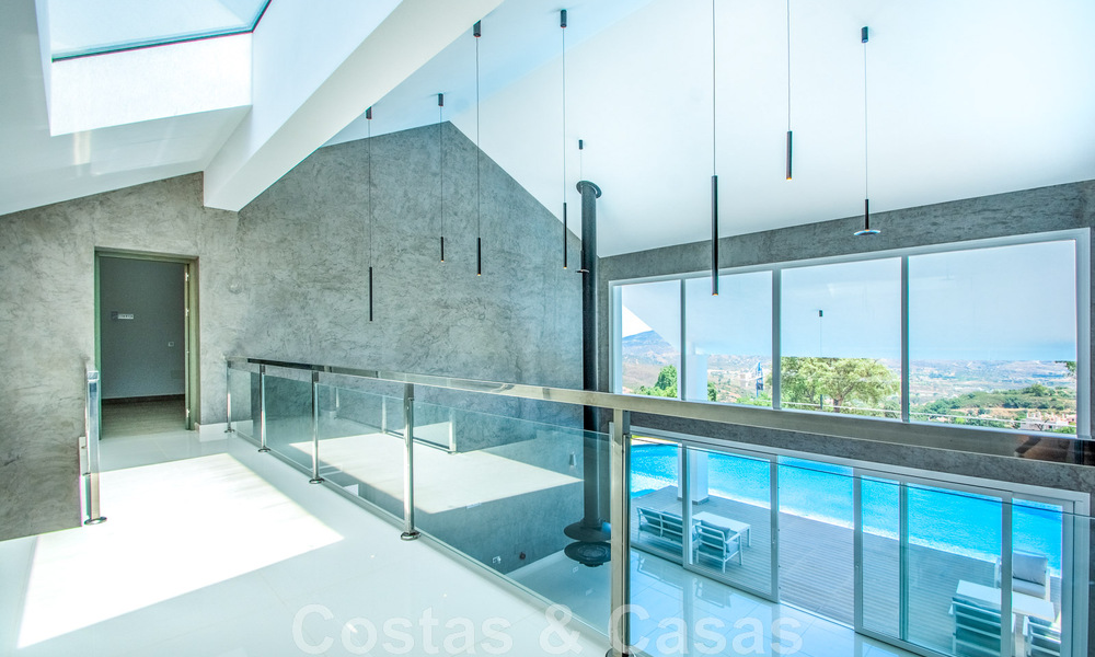 Detached villa for sale designed with modern architecture on a high position with panoramic mountain and sea views, in an exclusive urbanisation in East Marbella 48004