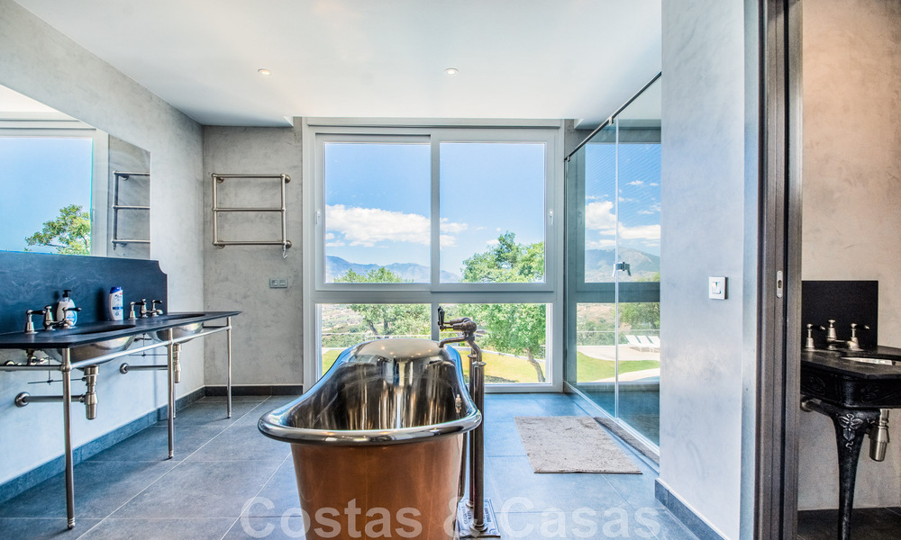 Detached villa for sale designed with modern architecture on a high position with panoramic mountain and sea views, in an exclusive urbanisation in East Marbella 48010