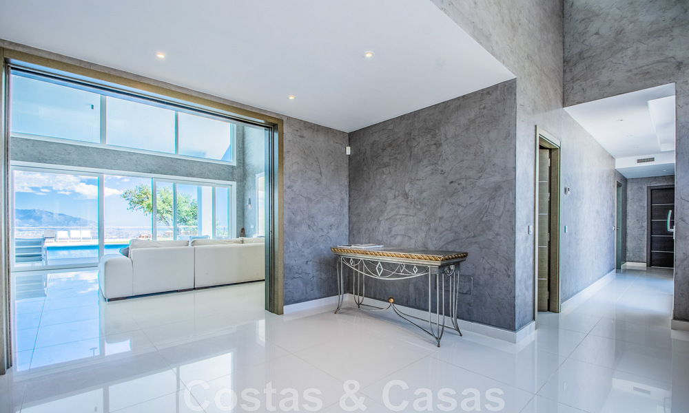 Detached villa for sale designed with modern architecture on a high position with panoramic mountain and sea views, in an exclusive urbanisation in East Marbella 48015