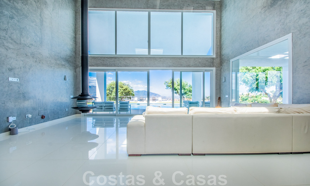 Detached villa for sale designed with modern architecture on a high position with panoramic mountain and sea views, in an exclusive urbanisation in East Marbella 48023