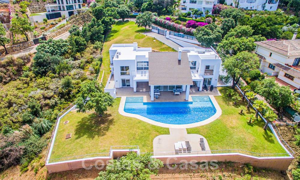 Detached villa for sale designed with modern architecture on a high position with panoramic mountain and sea views, in an exclusive urbanisation in East Marbella 48033