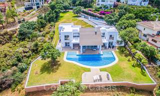 Detached villa for sale designed with modern architecture on a high position with panoramic mountain and sea views, in an exclusive urbanisation in East Marbella 48033 