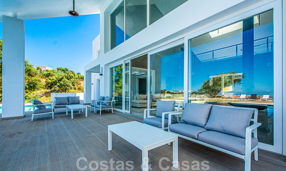 Detached villa for sale designed with modern architecture on a high position with panoramic mountain and sea views, in an exclusive urbanisation in East Marbella 48038