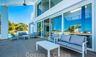 Detached villa for sale designed with modern architecture on a high position with panoramic mountain and sea views, in an exclusive urbanisation in East Marbella 48038 