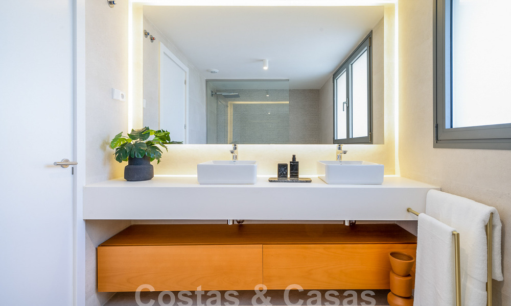 Superb show home for sale in a new development comprising semi-detached villas with sea views in a luxury resort Mijas, Costa del Sol 48588