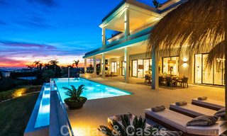 Exclusive designer villa with panoramic sea views for sale in the a five-star golf resort in Marbella - Benahavis 48822 