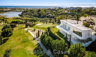 Frontline golf luxury villa in an elegant modern style with stunning golf and sea views for sale in Los Flamingos Golf resort in Marbella - Benahavis 48927 