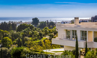 Frontline golf luxury villa in an elegant modern style with stunning golf and sea views for sale in Los Flamingos Golf resort in Marbella - Benahavis 48941 