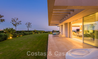 Frontline golf luxury villa in an elegant modern style with stunning golf and sea views for sale in Los Flamingos Golf resort in Marbella - Benahavis 48954 