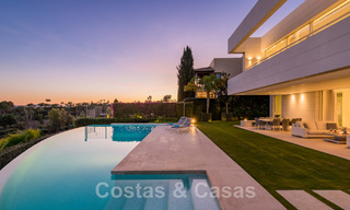 Frontline golf luxury villa in an elegant modern style with stunning golf and sea views for sale in Los Flamingos Golf resort in Marbella - Benahavis 48955 