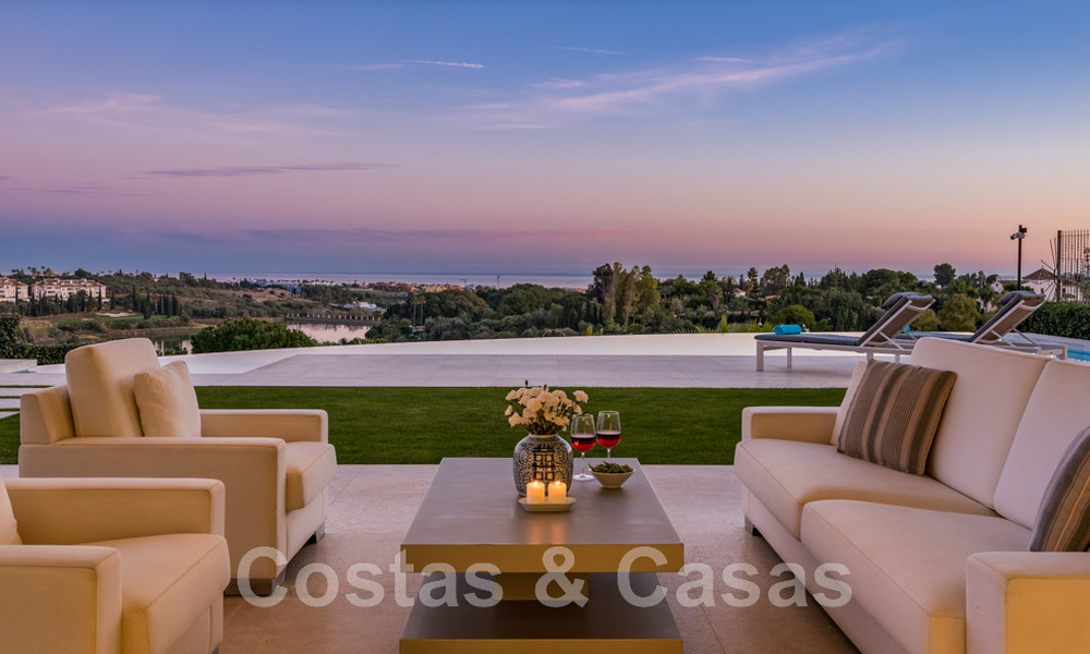 Frontline golf luxury villa in an elegant modern style with stunning golf and sea views for sale in Los Flamingos Golf resort in Marbella - Benahavis 48960