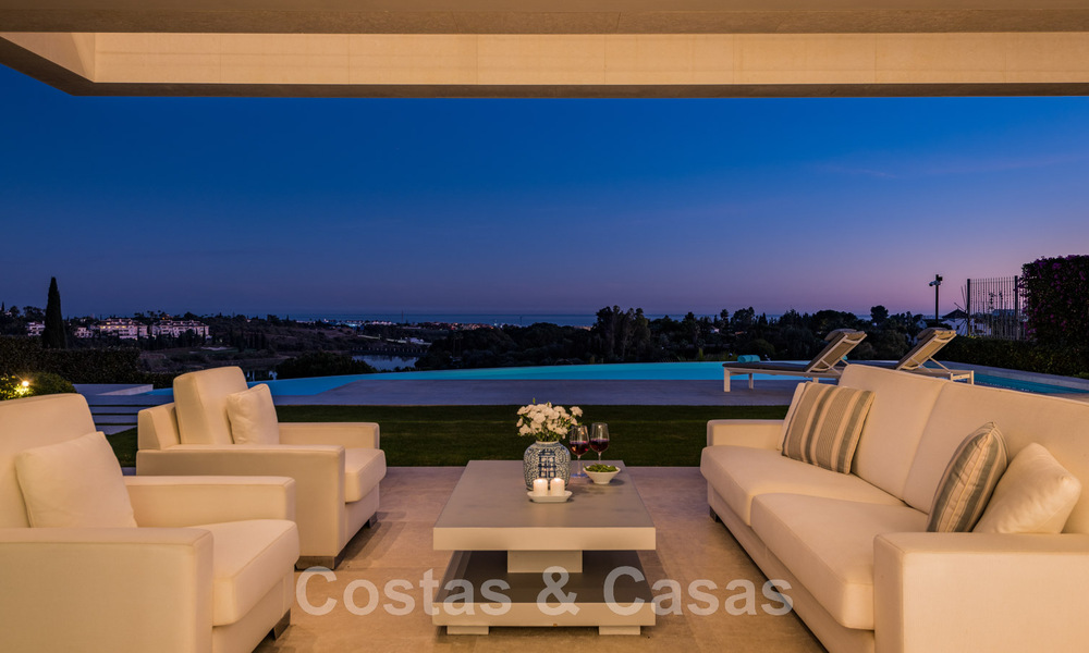 Frontline golf luxury villa in an elegant modern style with stunning golf and sea views for sale in Los Flamingos Golf resort in Marbella - Benahavis 48961