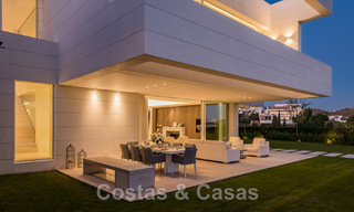 Frontline golf luxury villa in an elegant modern style with stunning golf and sea views for sale in Los Flamingos Golf resort in Marbella - Benahavis 48972 