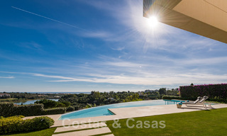 Frontline golf luxury villa in an elegant modern style with stunning golf and sea views for sale in Los Flamingos Golf resort in Marbella - Benahavis 48974 