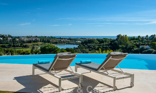 Frontline golf luxury villa in an elegant modern style with stunning golf and sea views for sale in Los Flamingos Golf resort in Marbella - Benahavis 49006 