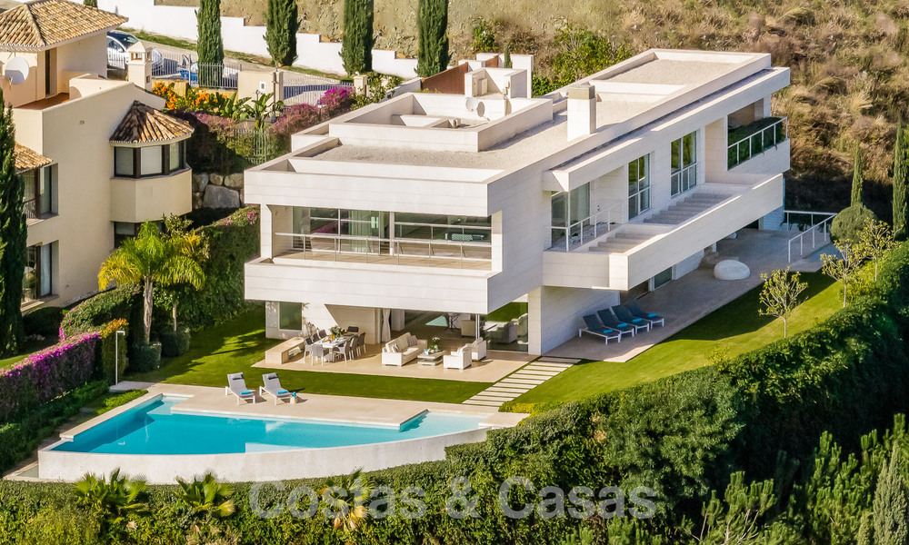 Frontline golf luxury villa in an elegant modern style with stunning golf and sea views for sale in Los Flamingos Golf resort in Marbella - Benahavis 49026
