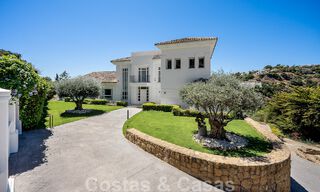 Elegant, Spanish luxury villa for sale with a private tennis court in a gated residential area in La Quinta, Benahavis - Marbella 50381 
