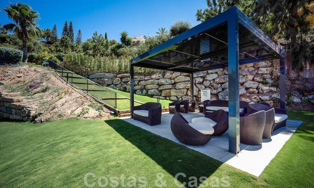 Elegant, Spanish luxury villa for sale with a private tennis court in a gated residential area in La Quinta, Benahavis - Marbella 50387