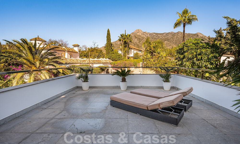 Luxury villa in contemporary architectural style for sale with sea views, located in a desirable residential area on Marbella's Golden Mile 50173