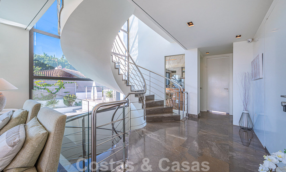 Luxury villa in contemporary architectural style for sale with sea views, located in a desirable residential area on Marbella's Golden Mile 50195