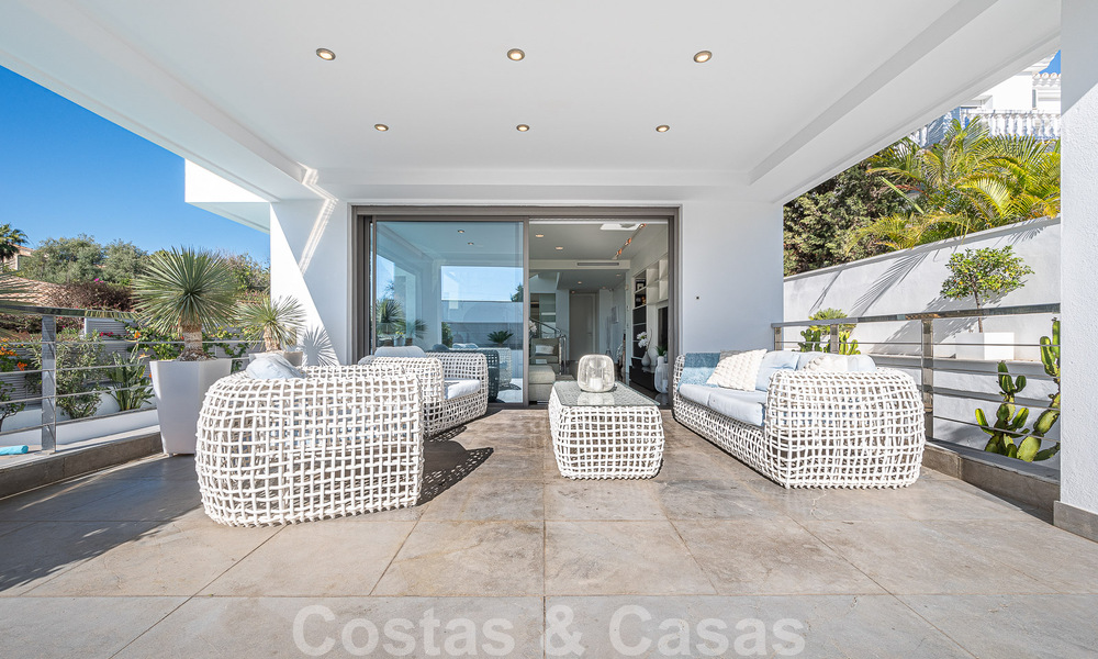 Luxury villa in contemporary architectural style for sale with sea views, located in a desirable residential area on Marbella's Golden Mile 50201