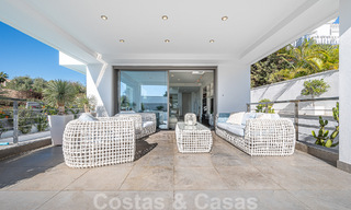 Luxury villa in contemporary architectural style for sale with sea views, located in a desirable residential area on Marbella's Golden Mile 50201 