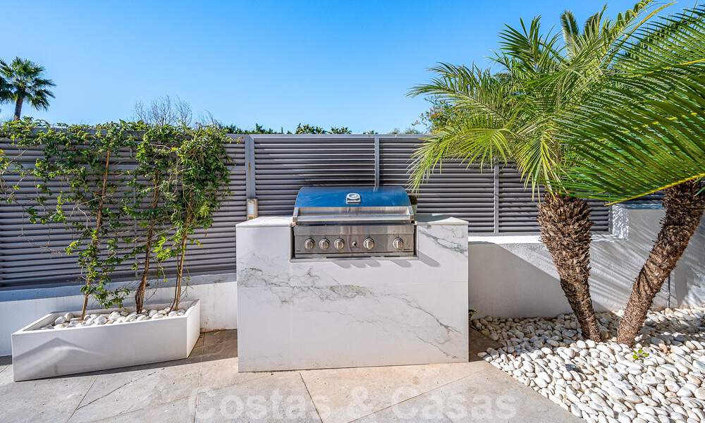 Luxury villa in contemporary architectural style for sale with sea views, located in a desirable residential area on Marbella's Golden Mile 50204
